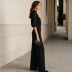 Close-up detail of the delicate sheer sleeves and the soft chiffon fabric texture of the Lysandra blouse.