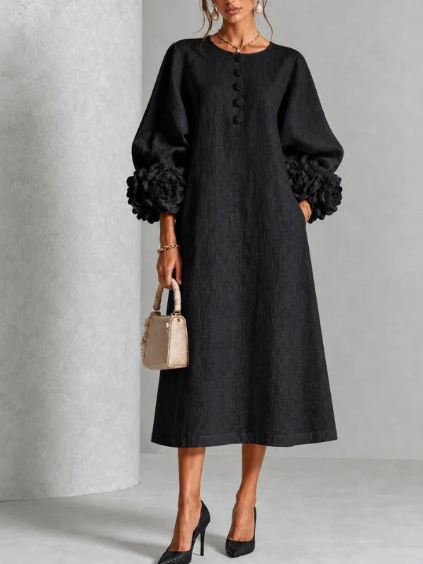Front view of a woman wearing the white Elowen midi button dress, styled casually with sandals.