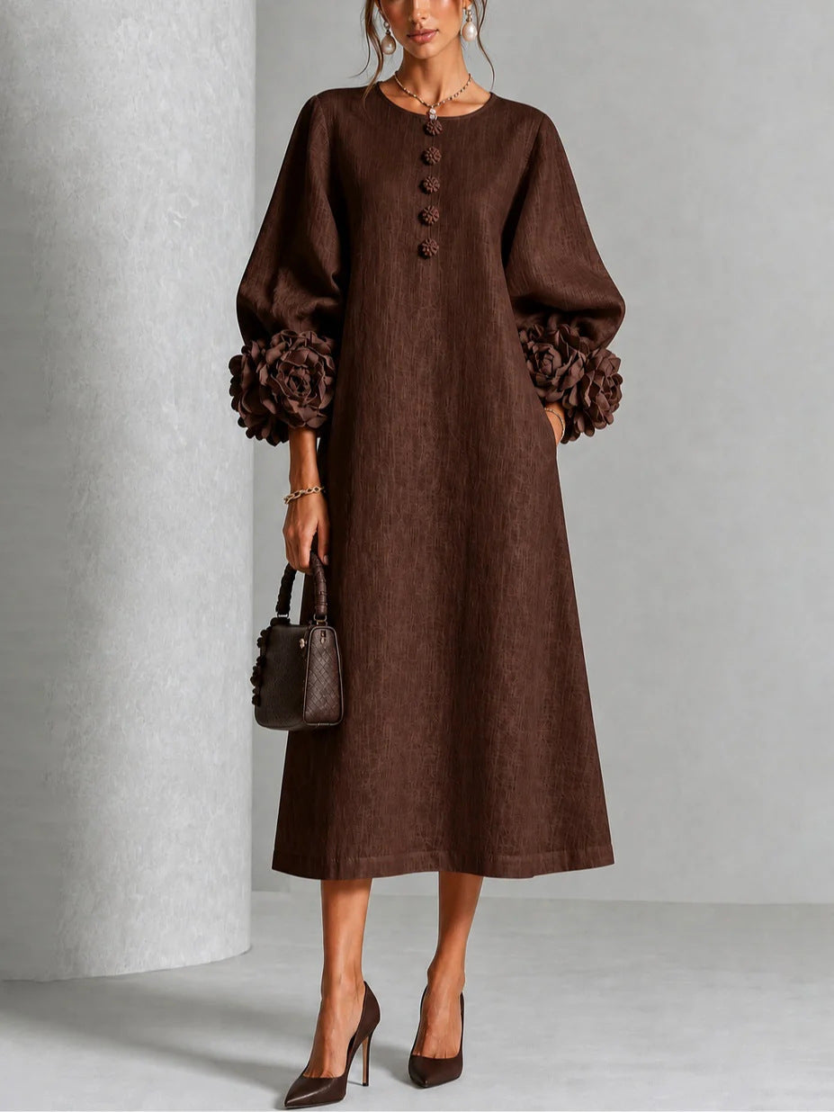 Full-length shot of the brown Elowen midi button dress, emphasizing its versatile and flattering silhouette.