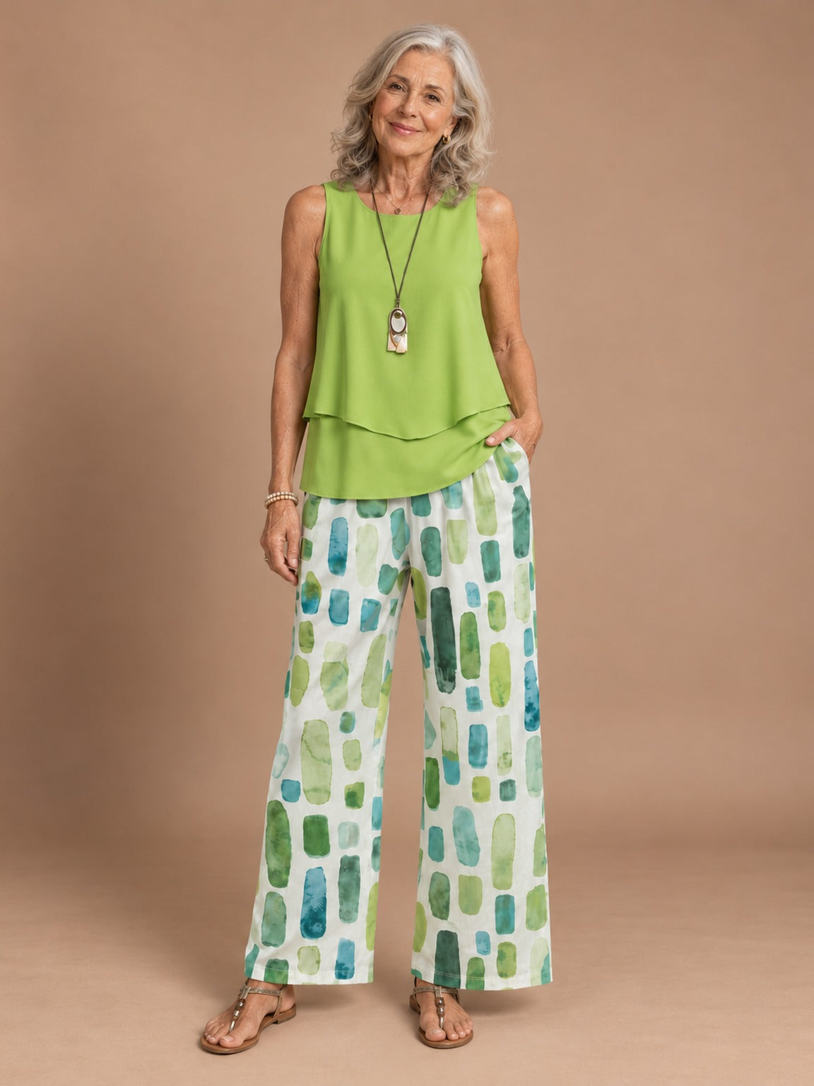 Woman wearing the green Callista Flowy Two-Piece Set
