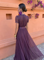 Woman wearing the comfortable chiffon maxi dress, walking outdoors, highlighting its graceful movement.