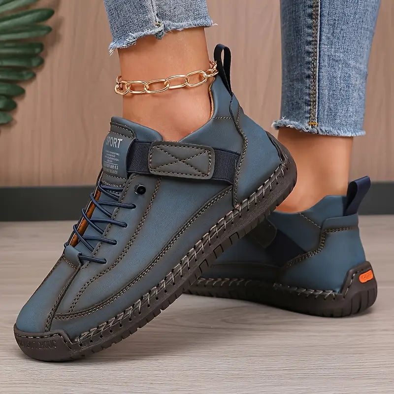 Detailed shot of the anti-slip outsole of a dark blue sneaker, showing traction and stability.