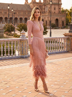 Front view of the pink long-sleeve dress, highlighting its flattering silhouette and elegant appeal.