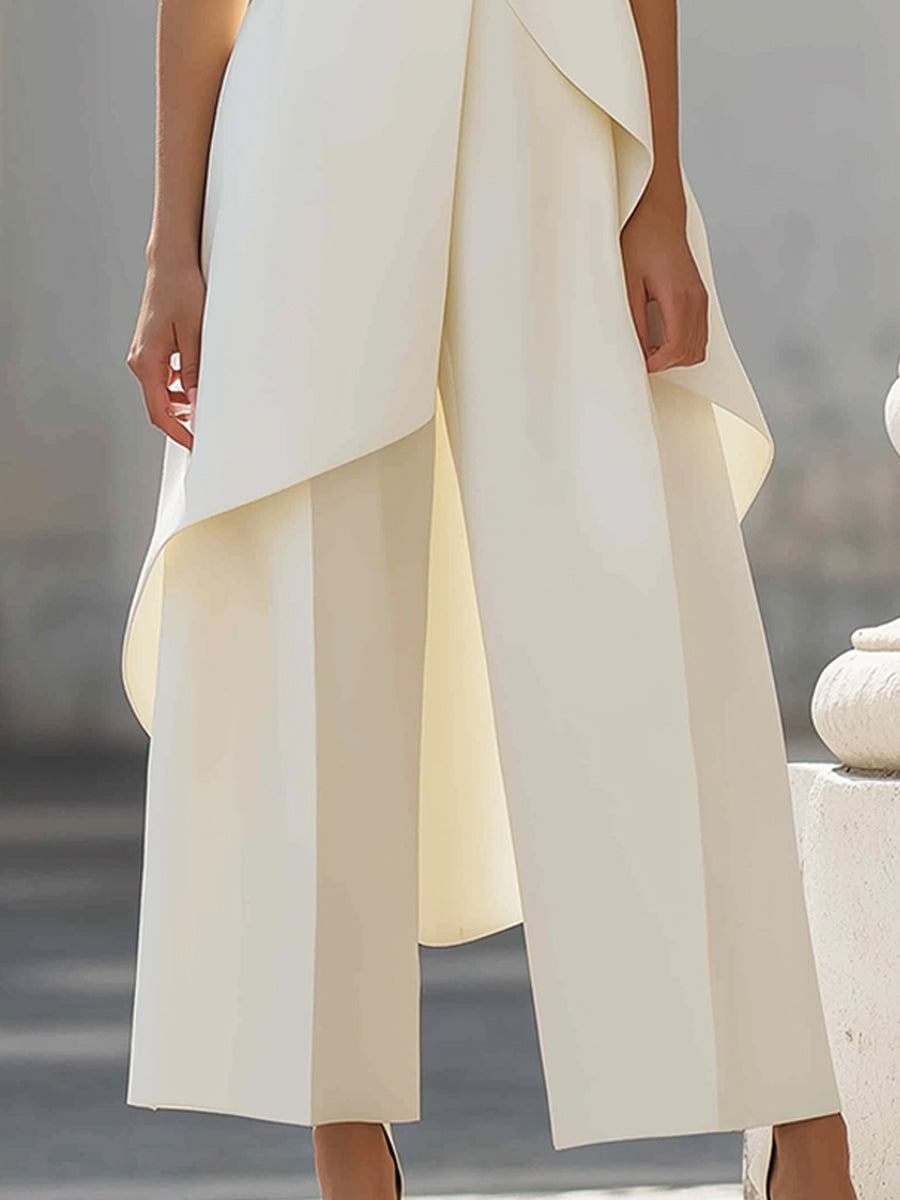 Detail of the stitching and finish around the high neck of the elegant sleeveless jumpsuit.