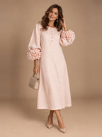 Woman wearing the pink Elowen Midi Button Dress