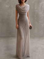 Full-length view of a woman wearing the flowing navy blue maxi dress, showcasing its comfortable and elegant drape.