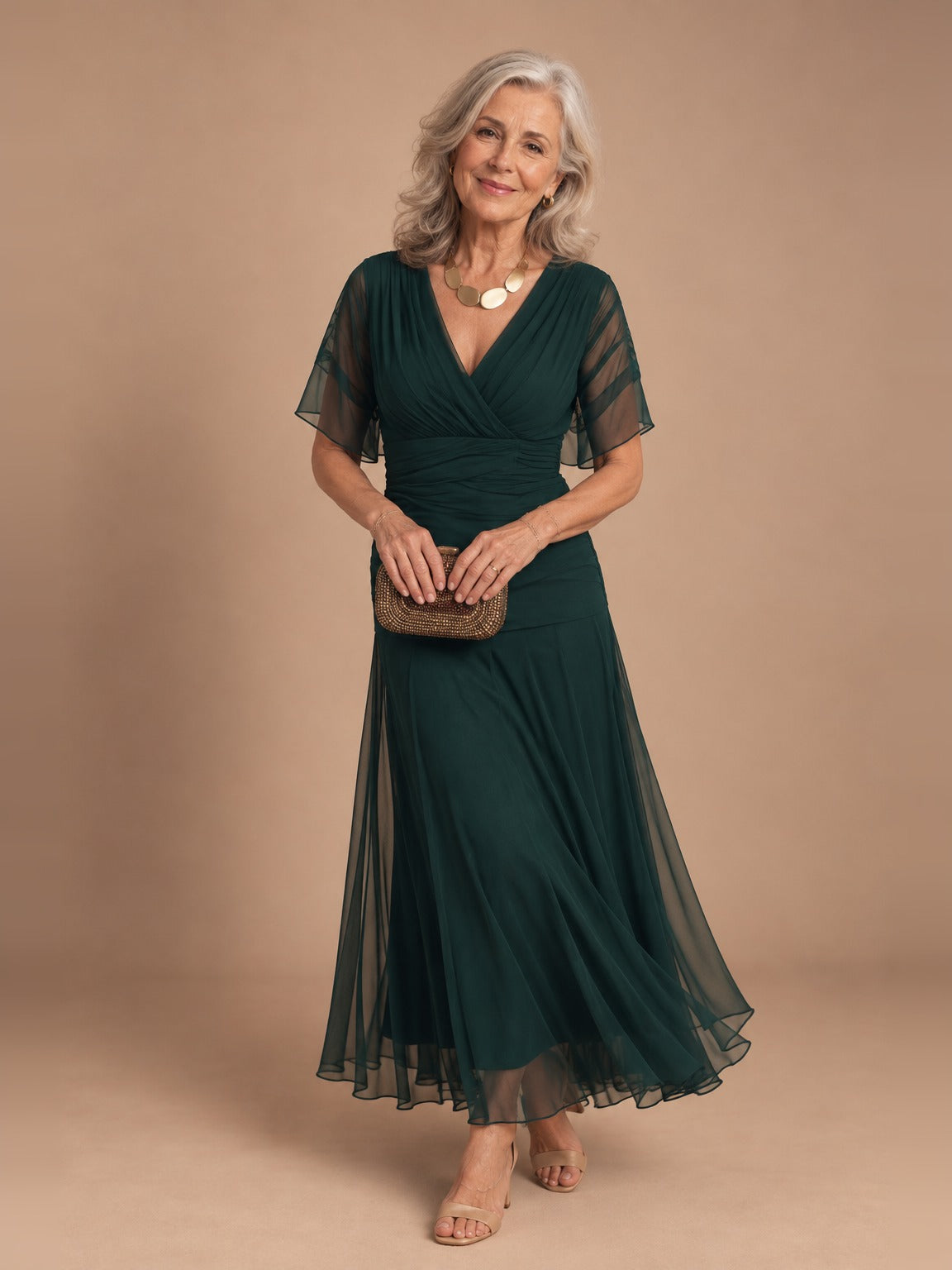 Woman wearing the dark green Isla Elegant Off-Shoulder Maxi Dress